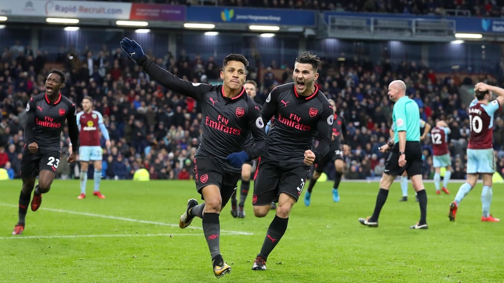Alexis Sanchez celebrates his late winner against Burnley. Photograph: Martin Rickett/PA