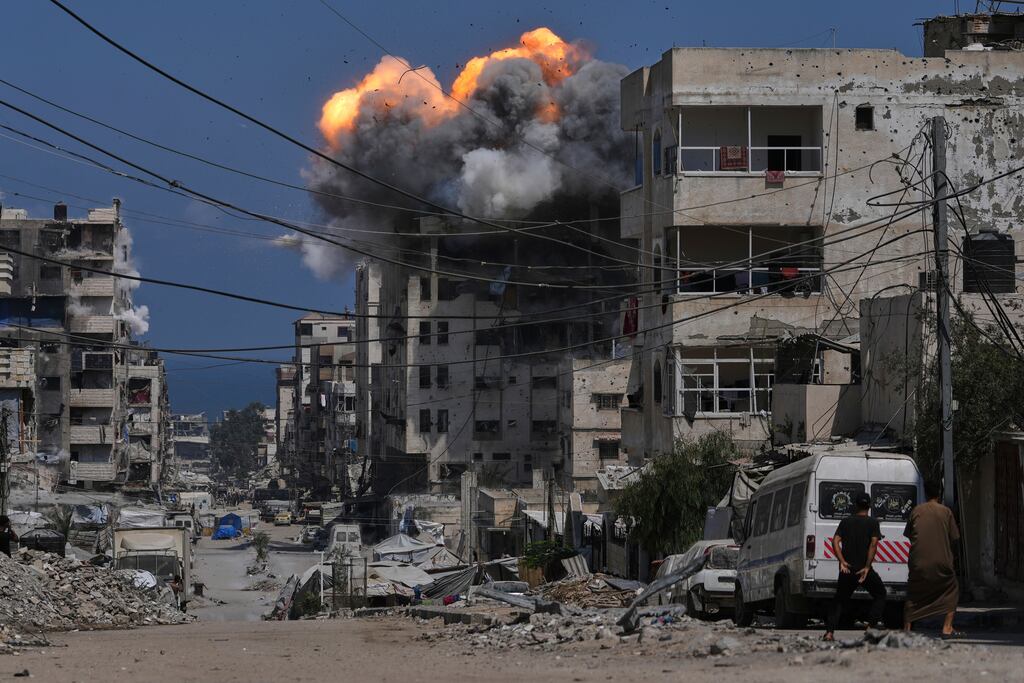 Smoke and fire erupt from a building following an Israeli air strike in Gaza City on Monday. Photograph: Jehad Alshrafi/AP