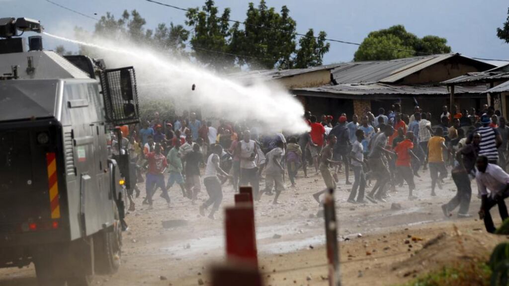 A water cannon is used by riot policemen to disperse protesters in the capital, Bujumbura. Photograph: Thomas Mukoya/Reuters