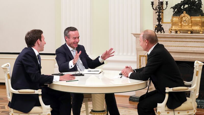 Vladimir Putin gives an interview to Financial Times editor Lionel Barber and the paper’s Moscow bureau chief Henry Foy. Photograph: Mikhail Klimentyev