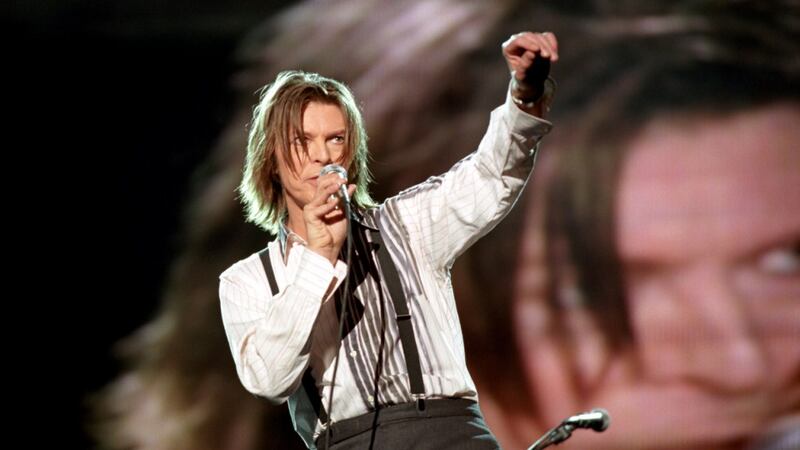 David Bowie performs at the Netaid Charity Concert For Third World Debt in Wembley Stadium, London in 1999. Photograph: Brian Rasic/Getty Images