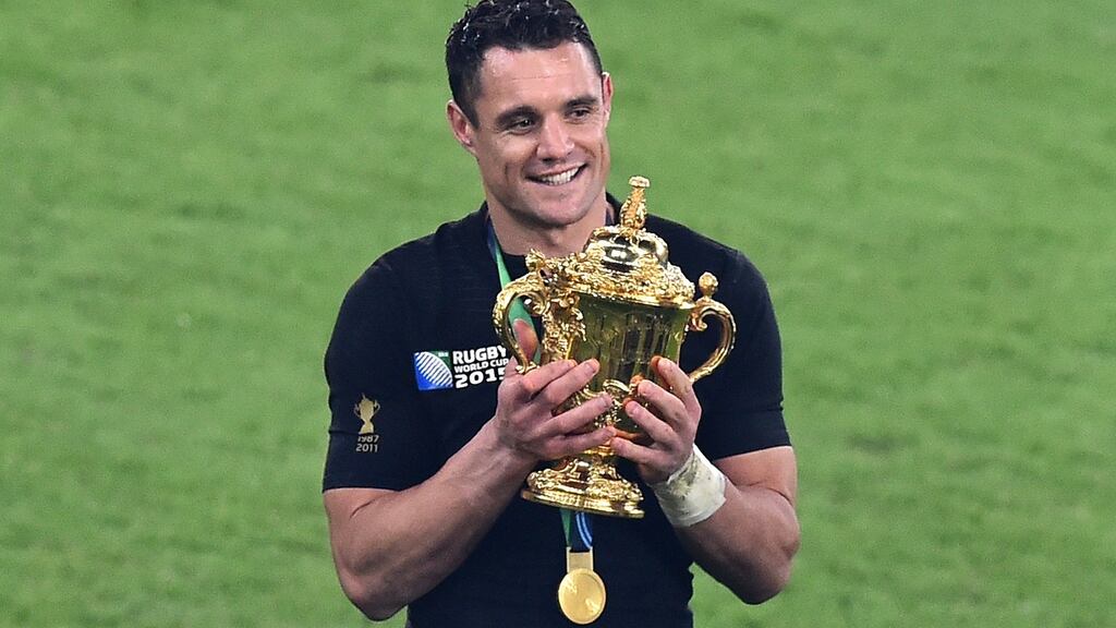 New Zealand’s fly half Dan Carter holds the Webb Ellis Cup as he celebrates winning the 2015 Rugby World Cup at Twickenham Photograph: Gabriel Bouys/AFP