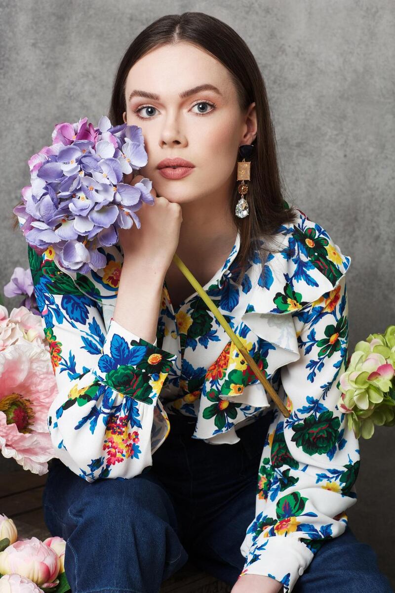 Floral blouse €430 MSGM, utility denim trousers €149 Whistles, Brown Thomas, earrings €17 River Island.