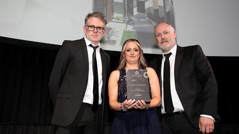 Lisa Cullen, Sales Director, Aperture Glazing, presents the House Extension Refurbishment award to Gareth Brennan and Séamus Furlong, Brennan | Furlong Architects.