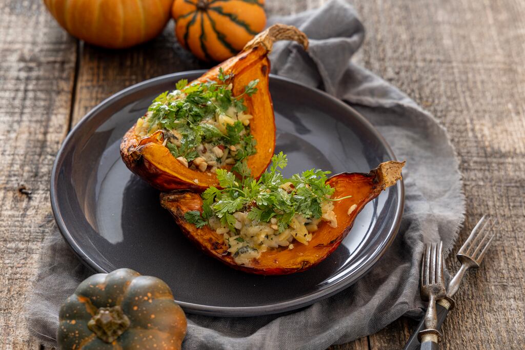 Roasted pumpkin stuffed with orzo and blue cheese. Photograph: Harry Weir