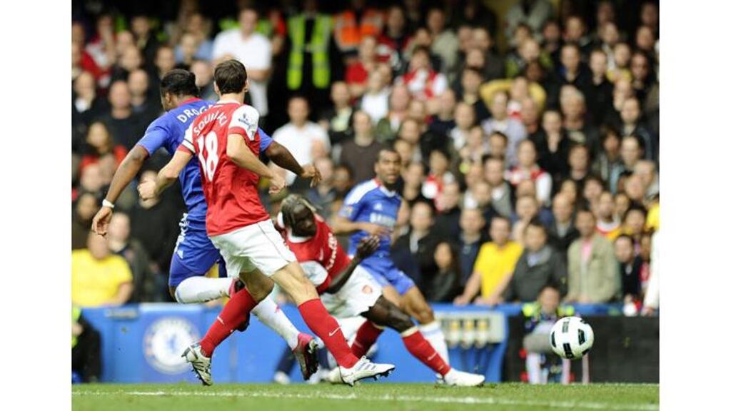 Didier Drogba expertly flicks Ashley Cole’s cross off the post and beyond Lukasz Fabianski to put Chelsea 1-0 up at Stamford Bridge. Photograph: Dylan Martinez/Reuters