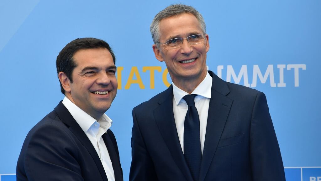 Greek prime minister Alexis Tsipras shakes hands with Nato secretary general Jens Stoltenberg during the Nato summit in Brussels. Photograph: Denis Charlet/AFP/Getty Images