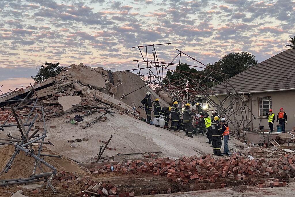 Rescue workers at the scene of the collapsed building in George in South Africa's Western Cape province. Photograph: Willie Van Tonder/Getty Images