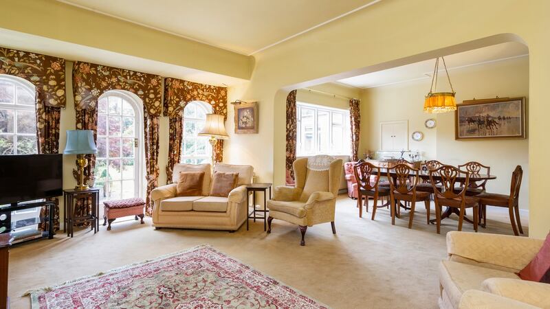 Living room with arch into the dining room