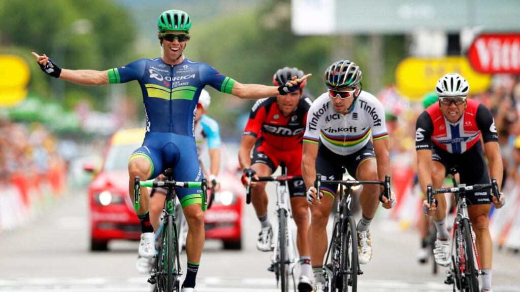 Australian rider Michael Matthews  of the Orica BikeExchange team celebrates after winning the 10th stage of the Tour de France  ahead of second placed Peter Sagan  and third placed  Edvald Boasson Hagen. Photograph: Yoan Valat/EPA