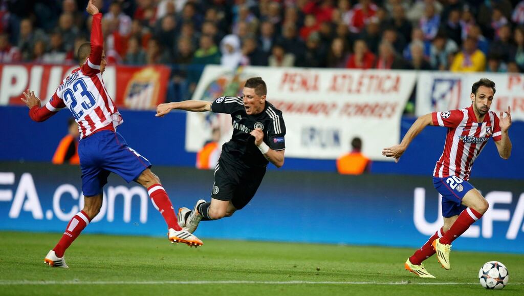 Atletico Madrid’s Juanfran runs for the ball as his team-mate Miranda (left) fouls Chelsea’s Fernando Torres during their Champions League semi-final first leg match at Vicente Calderon stadium. Photograph: Reuters.