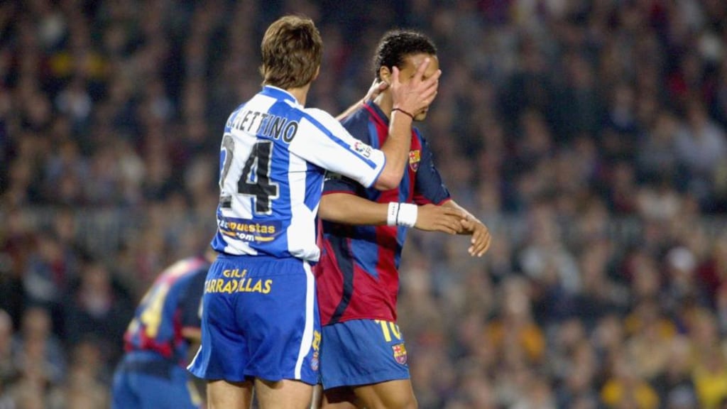 Mauricio Pochettino in his playing days with Espanyol, up against rivals Barcelona at the Camp Nou Stadilum in 2004. Photograph: Getty Images