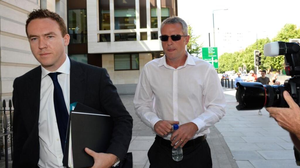 James Gilmour (right) leaves Westminster Magistrates Court in central London. Photograph: Paul Hackett/Reuters