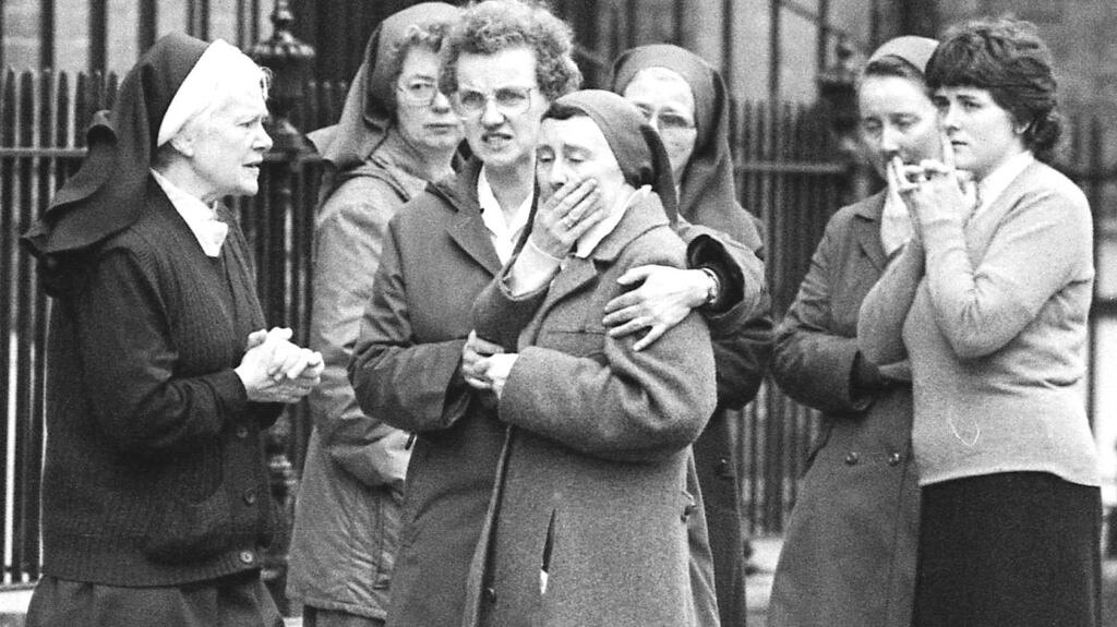 Members of the Loreto order outside the convent on St Stephen’s Green as the bodies of the fire victims were being removed. Photograph: Tom Lawlor