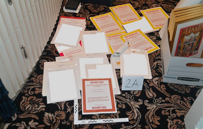 An image the US department of justice shows documents marked SECRET//SCI that were recovered from Donald Trump’s Mar-a-Lago club and home in Florida. Photograph: Department of justice via the New York Times