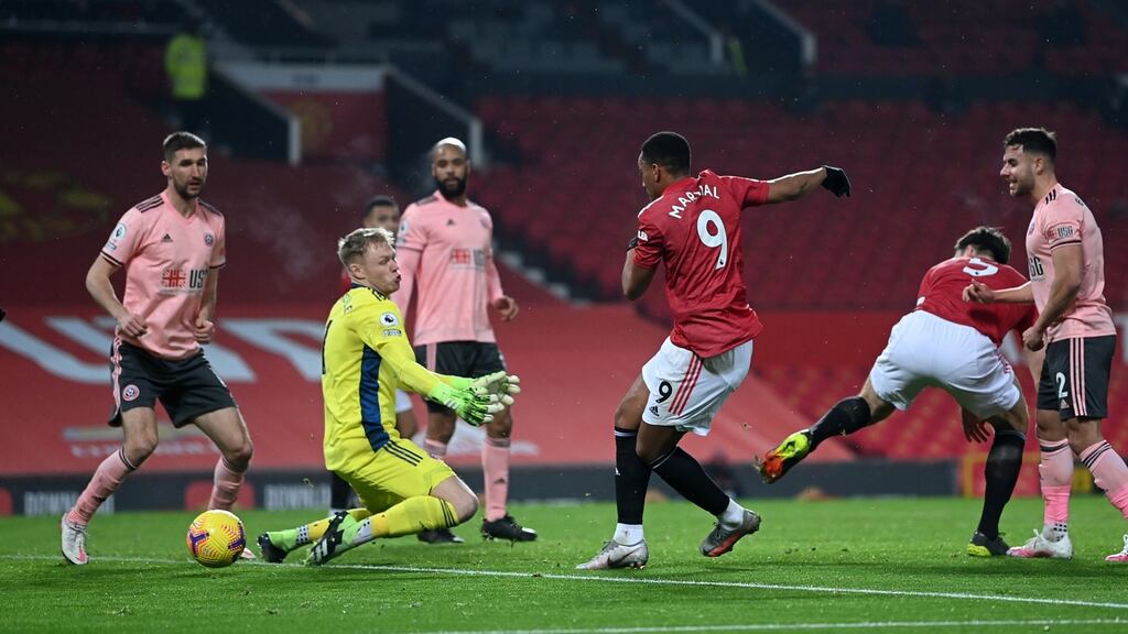 Anthony Martial of Manchester United scores a goal which is later disallowed after a foul on Aaron Ramsdale of Sheffield United during the Premier League match at Old Trafford. Photo: Laurence Griffiths/Getty Images