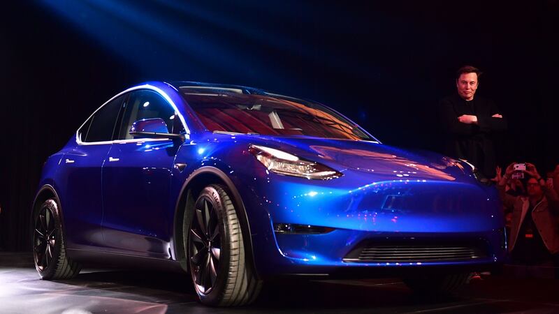 Tesla CEO Elon Musk views the Tesla Model Y. It's currently more expensive second-hand than it is new,