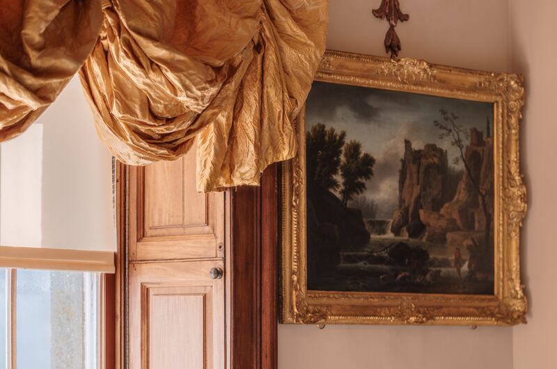 Windows are adorned by rich, golden ruched curtains made by Julia Davis Goff. Photograph: Joanna Barry