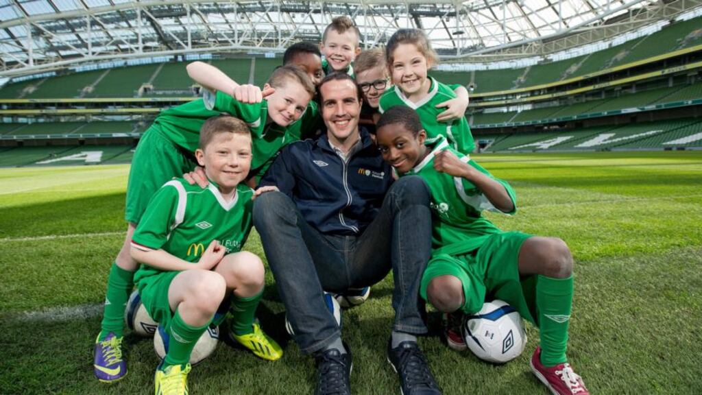 John O’Shea with Ryan Kirwan, Darragh Keane, Gideon Star, Cole Cunningham, Craig Sheridan, Ellie Meade and Sam Matundo from Corduff FC at the Aviva. Photograph: Inpho