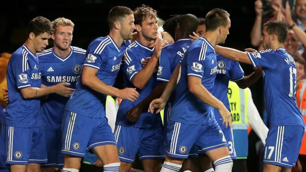 Branislav Ivanovic (centre) of Chelsea is congratulated by teammates after scoring his team’s winner against Aston Villa at Stamford Bridge. Photograph: Scott Heavey/Getty Images