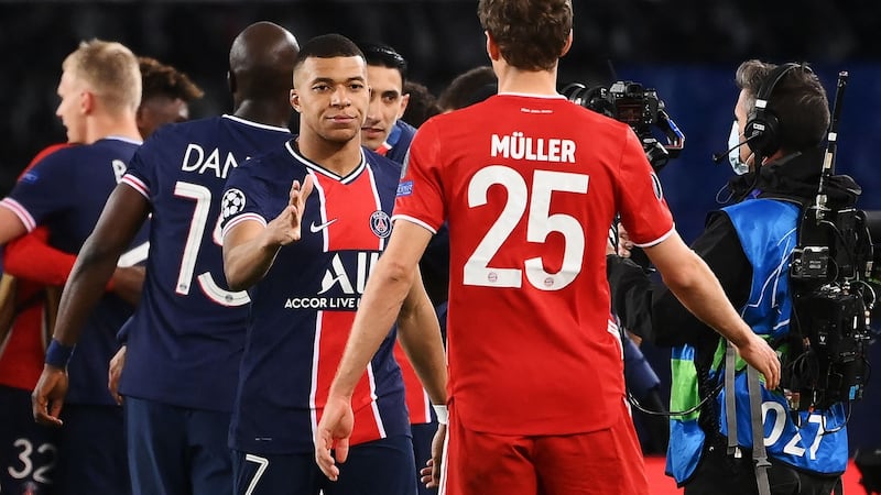 Paris Saint-Germain’s Kylian Mbappe shakes hands with Bayern Munich’s Thomas Müller after the Champions League quarter-final, second leg at the Parc des Princes. Photograph: Franck Fife/AFP via Getty Images