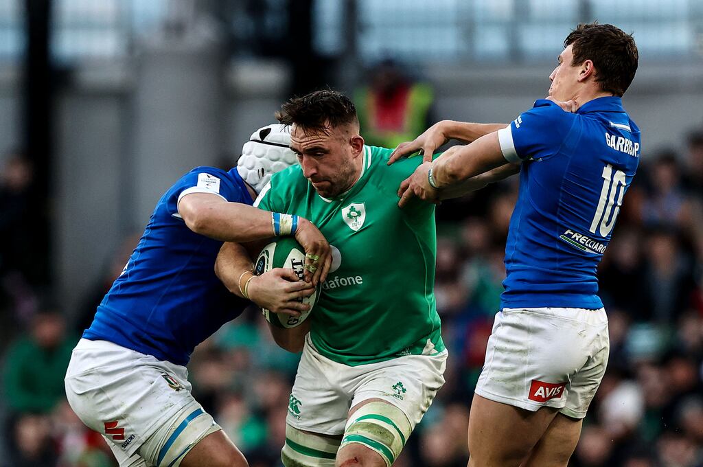 Ireland's Jack Conan comes under pressure from Italy's Paolo Garbisi at the Aviva Stadium last Sunday. Photograph: Ben Brady/Inpho