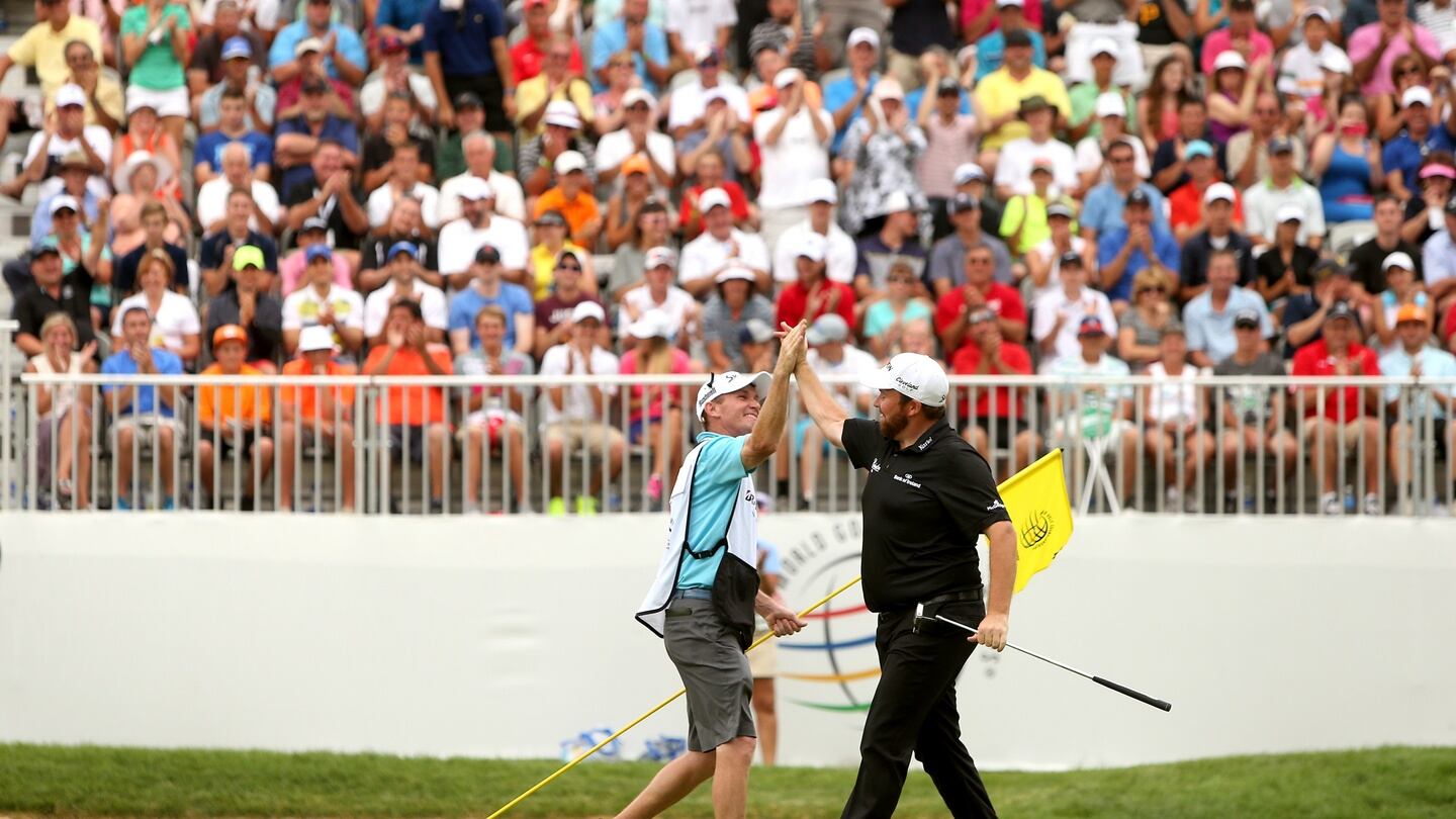 Shane Lowry celebrates with his caddy after winning the WGC Bridgestone Invitational at Firestone. Photo: Getty Images