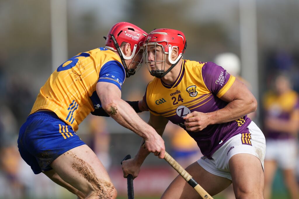 Wexford's Lee Chin is challenged by John Conlon of Clare during the Allianz Hurling League Division 1A match at Cusack Park in Ennis. Photograph: James Lawlor/Inpho