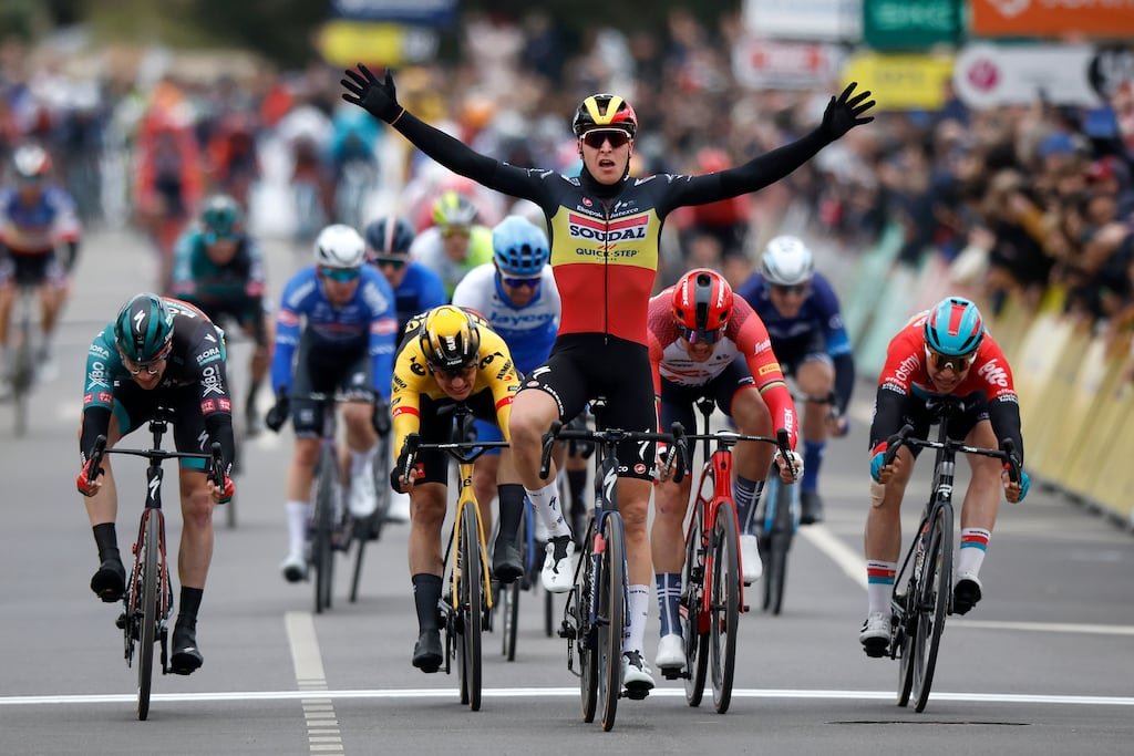 Belgian rider Tim Merlier celebrates crossing the finish line to win the first stage of the Paris-Nice race. Photograph: EPA