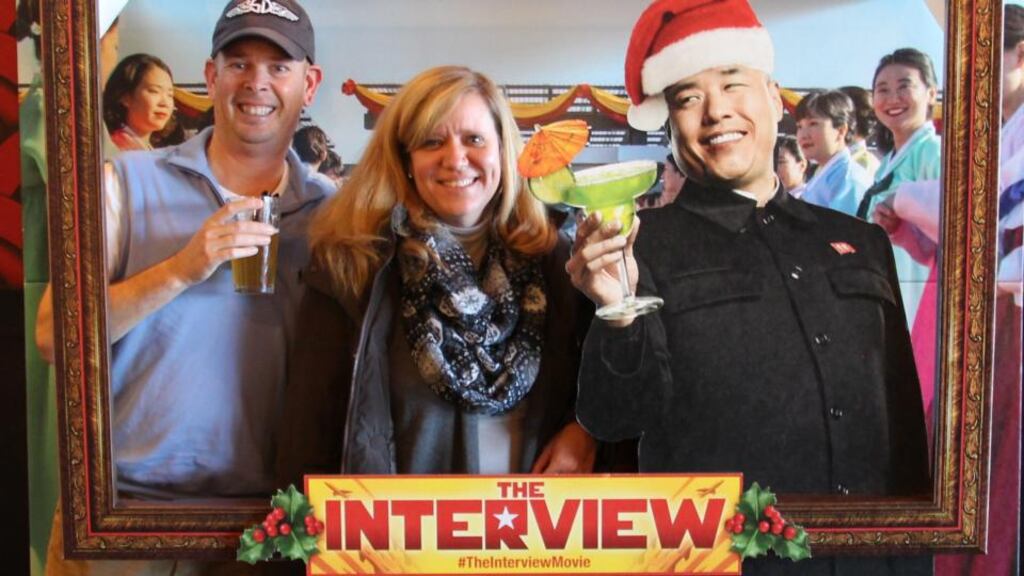 North Korea blamed the US for internet outages, referring to president Obama as a “monkey in a tropical forest”. Above, moviegoers pose in a photo booth ahead of viewing ‘The Interview’ Photograph: Yonyap/EPA