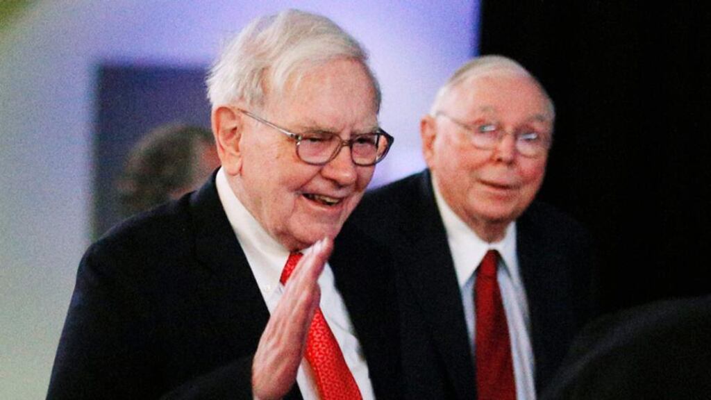 Berkshire Hathaway chairman Warren Buffett (left) and vice chairman Charlie Munger arrive to begin the company’s annual meeting in Omaha. Photograph: Rick Wilking/Reuters