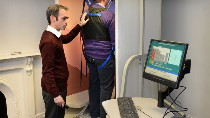 Dr Douglas Duffy, chartered physiotherapist, with a patient at The Balance Centre, Ranelagh Road, Dublin. Photograph: Dara Mac Dónaill