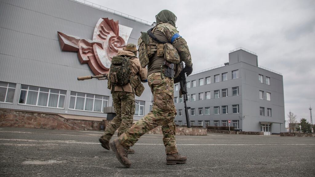 Ukrainian servicemen walk at the Chernobyl nuclear plant on April 5th. Photograph: Oleksandr Ratushniak/AP