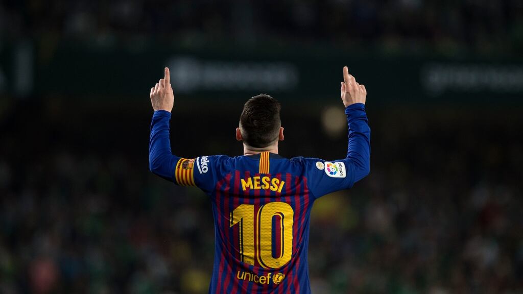 Barcelona’s Lionel Messi celebrates scoring the opening goal at the Benito Villamarin stadium on Sunday. Photograph: Jorge Guerrero/AFP