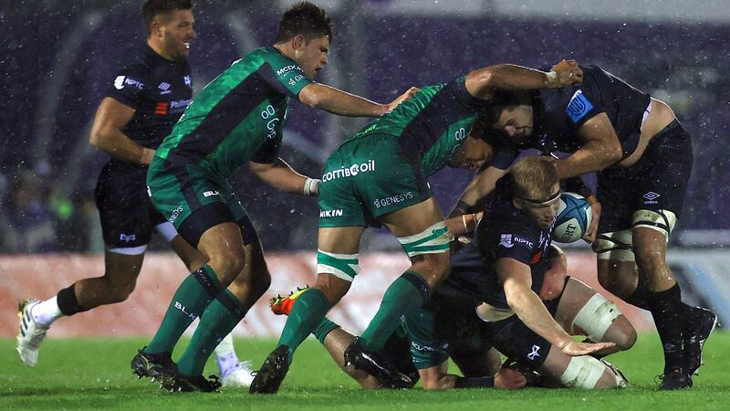 Sam Cross is tackled by Jarrad Butler and Dave Heffernan. Photo: Ben Brady/Inpho