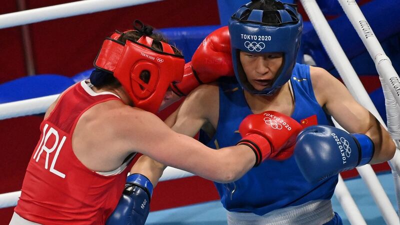 Aoife O’Rourke (red) in action against Li Qian during their women’s middleweight round of 16 fight. Photo: Luis Robayo/AFP via Getty Images