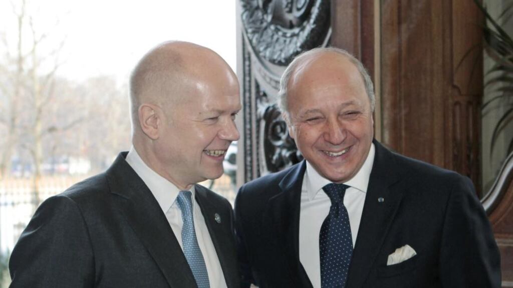 France foreign affairs minister, Laurent Fabius (right) welcomes British foreign secretary  William Hague before an international meeting of the Friends of Syria Core Group  in Paris today. Photograph: getty