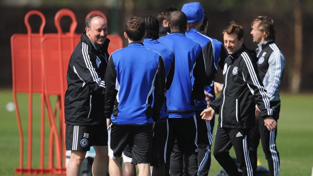 Chelsea manager Rafa Benitez shakes hands with his players during a training session ahead at Cobham in London. Photograph: Christopher Lee/Getty Images