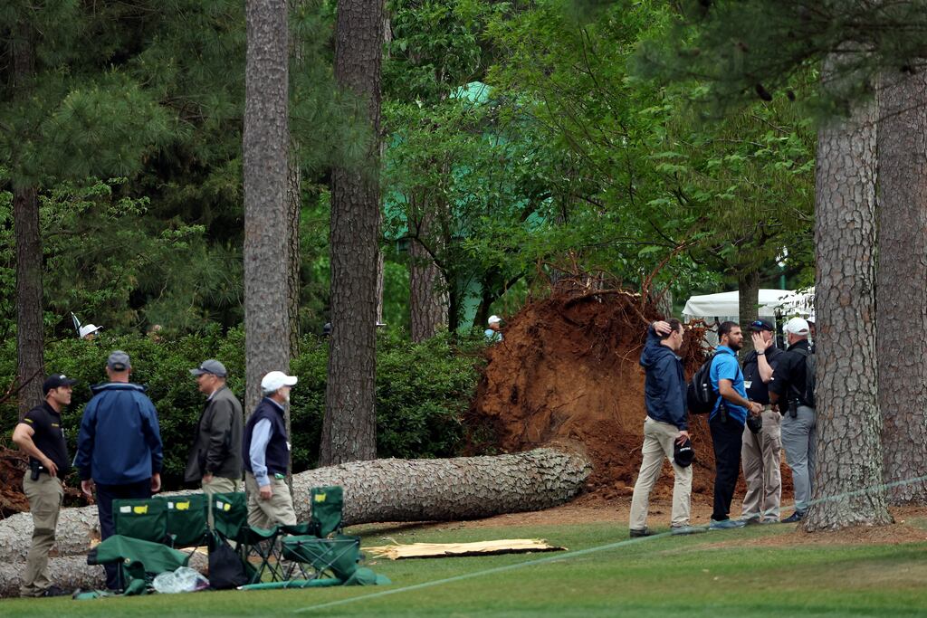 Course officials look over fallen pine trees on the 17th hole during the second round of the 2023 Masters Tournament at Augusta National Golf Club. Photograph: Patrick Smith/Getty Images