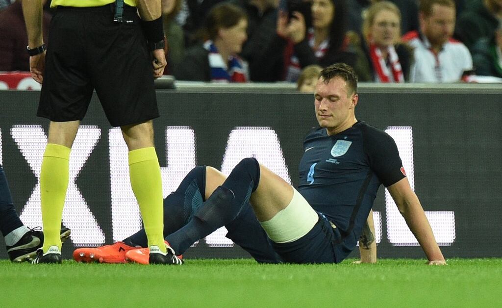 Phil Jones goes down injured during England’s friendly match with Germany at Wembley. Photo: EPA
