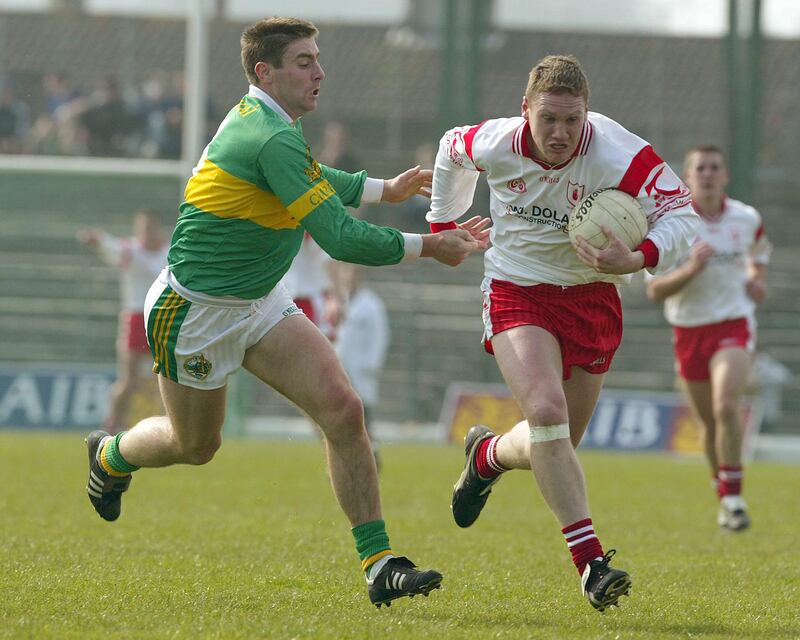 Cormac McAnallen takes on Kerry's Dara O'Sé in a National League match in 2003. Photograph: Lorraine O'Sullivan/Inpho