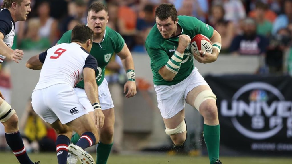 Ireland’s Peter O’Mahony runs at USA’s Mike Petri. Photograph: Inpho/Billy Stickland