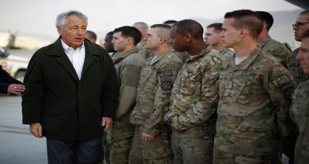 US secretary of defence Chuck Hagel greets US Army troops on the tarmac of Kabul airport before boarding a flight to Washington after a three day visit to Afghanistan. Photograph: Jason Reed-Pool/Getty Images.
