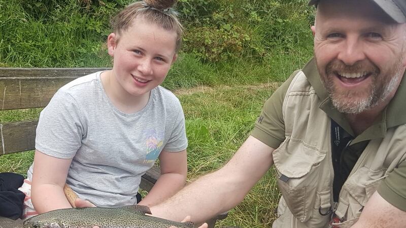 Mia Cass from Neighbourhood Youth Project, Blanchardstown with Rory Keatinge of DAI during a fishing trip to Rathbeggan Lake.