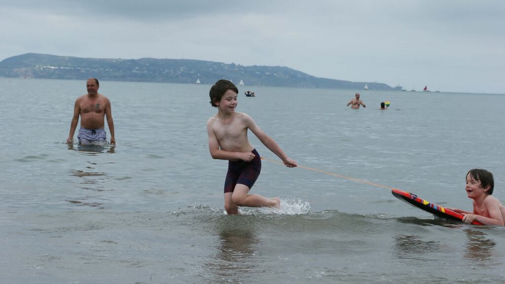 Oliver and Harry Barnes pictured at Seapoint, Dublin, enjoying the sunshine last weekend. Photograph: Stephen Collins/Collins Photos