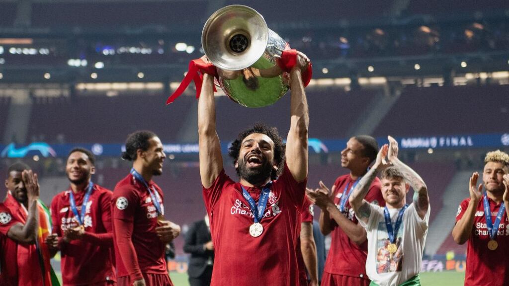Mohamed Salah  lifts the Champions League trophy after Liverpool’s victory over Tottenham Hotspur in Madrid. Photograph:  Matthias Hangst/Getty Images