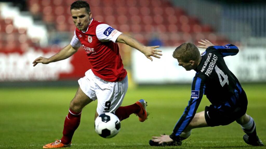 Two-goal hero Christy Fagan eludes the challenge of Athlone’s Derek Prendergast at Richmond Park. Photo: Ryan Byrne/Inpho
