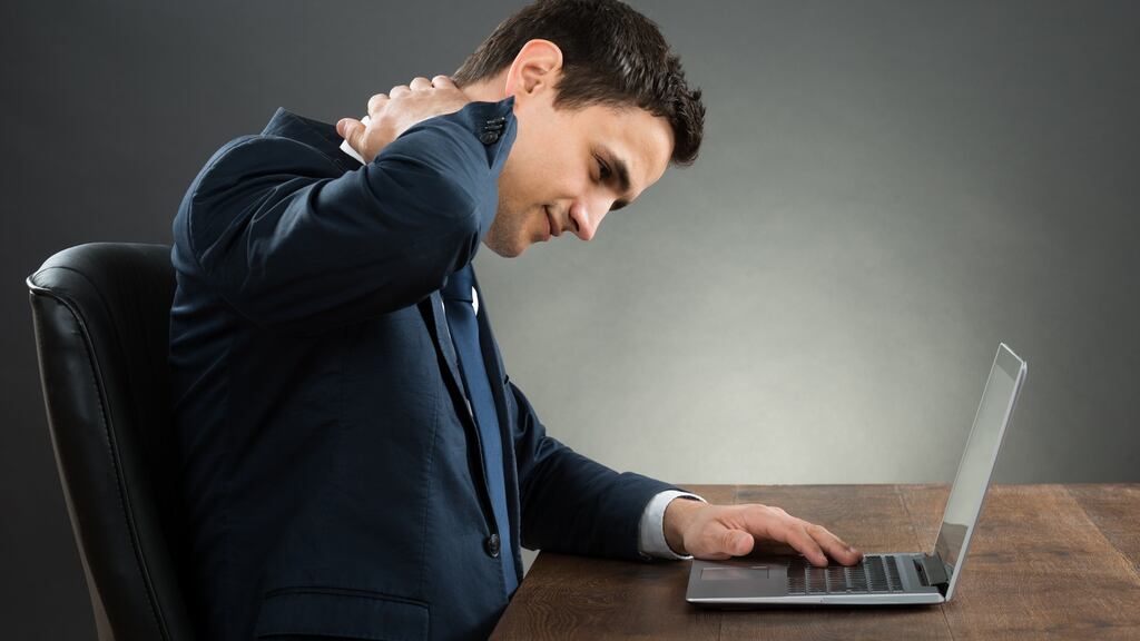 Assess your work set up, and strive for good posture if sitting at a computer. Photograph: iStock