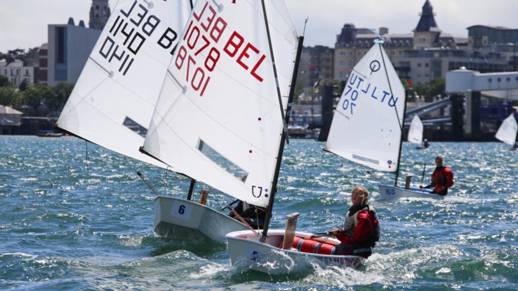 Belgium’s Ingeborg Bultynck sets her sails for the first blustery races of the 254-boat Optimist class European Championships off Dun Laoghaire yesterday. Photograph: David O’Brien