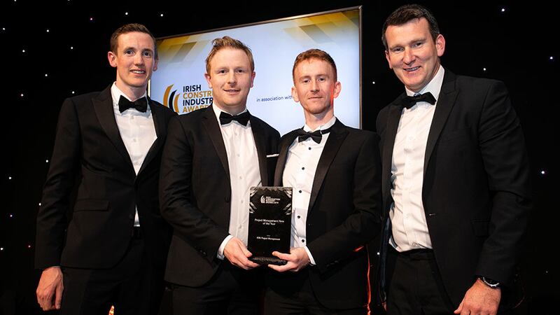 Davitt Lamon, Awards Judge presents the Project Management Firm of the Year award to the KSN Project Management team.